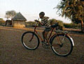 photo of boy on bicycle